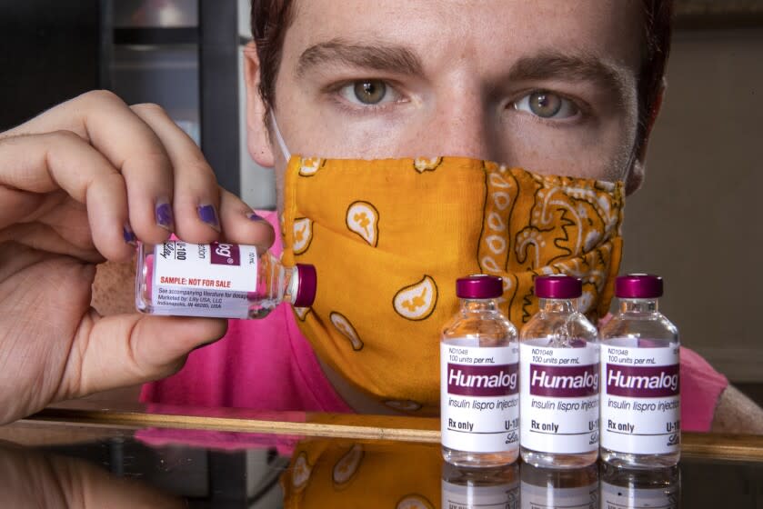 VAN NUYS, CA -AUGUST 05, 2020: Diabetes patient Adam Winney is photographed inside his apartment in Van Nuys next to 1000 unit samples of fast acting insulin that he received from his doctor. Winney said that each sample lasts him about 3 weeks. A bill is stuck in the Senate health committee right now that would cap insulin costs to $50 a month. Adam, who is currently unemployed because of the coronavirus outbreak, has been living off of the samples from his doctor since he can't afford to pay $1000 a month for insulin. (Mel Melcon / Los Angeles Times)
