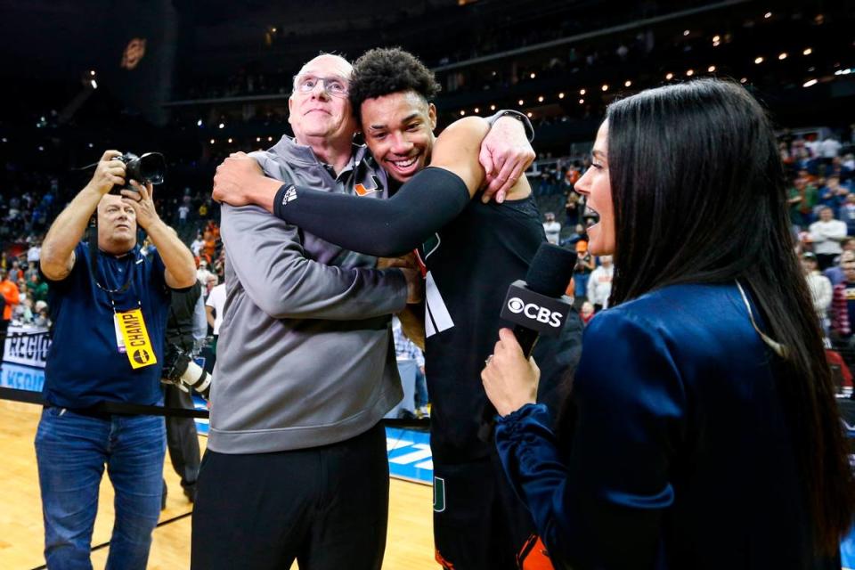 Mar 26, 2023; Kansas City, MO, USA; Miami Hurricanes head coach Jim Larranaga left, hugs guard Jordan Miller (11) as they celebrate defeating the Texas Longhorns at the T-Mobile Center. William Purnell/USA TODAY Sports