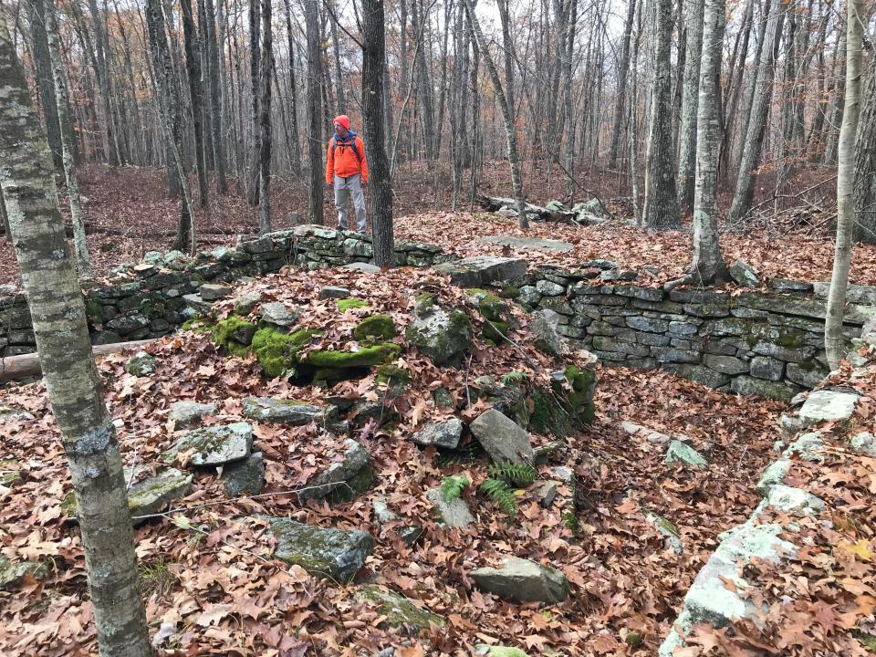 The remains of homestead foundations, stone walls, crumbing chimneys and wellheads that once made up a farming community are just off the trail.