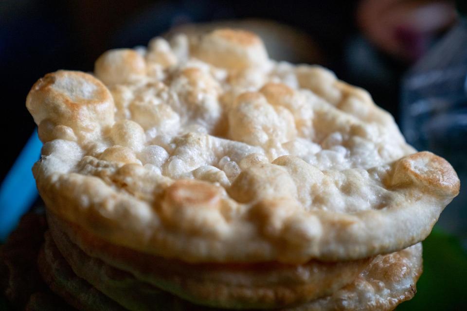 <p>Fry bread is actually <a href="https://www.thedailymeal.com/entertain/united-states-food-official-state-foods-slideshow?referrer=yahoo&category=beauty_food&include_utm=1&utm_medium=referral&utm_source=yahoo&utm_campaign=feed" rel="nofollow noopener" target="_blank" data-ylk="slk:the official state bread of South Dakota;elm:context_link;itc:0;sec:content-canvas" class="link ">the official state bread of South Dakota</a> and can trace its origins to the rations provided by the federal government to Native Americans in the mid-1800s — namely flour, lard, salt, yeast, powdered milk and sugar. The state’s large Sioux population took to frying the dough in the lard, resulting in a fluffy, flat, slightly chewy bread with a golden-brown crust. Nowadays, you can find fry bread all throughout the region and especially in Oklahoma. The two most popular variations are sweet, with cinnamon and sugar and a Navajo taco — topped with ground beef, lettuce, tomatoes, <a href="https://www.thedailymeal.com/easy-summer-salsa-and-dip-gallery?referrer=yahoo&category=beauty_food&include_utm=1&utm_medium=referral&utm_source=yahoo&utm_campaign=feed" rel="nofollow noopener" target="_blank" data-ylk="slk:salsa;elm:context_link;itc:0;sec:content-canvas" class="link ">salsa</a> and sour cream.</p>