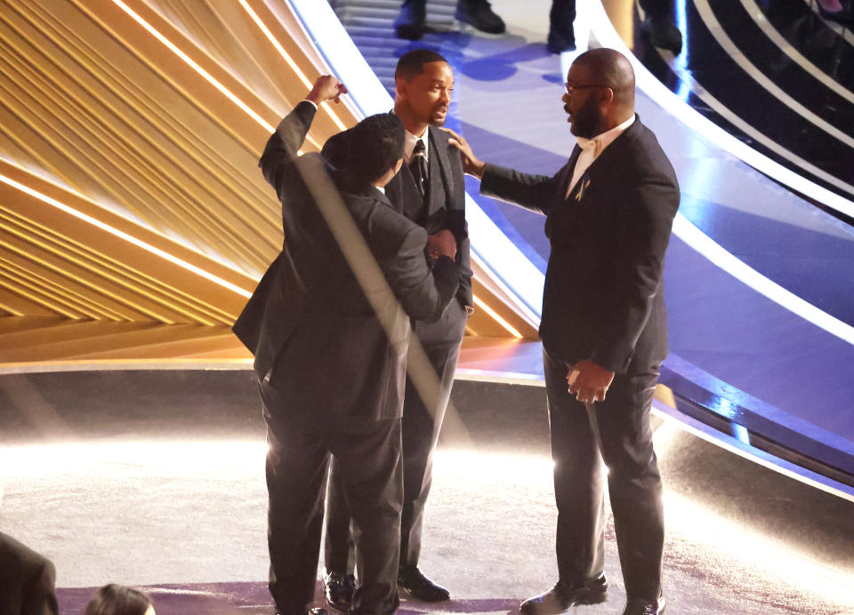 HOLLYWOOD, CA - March 27, 2022.   Denzel Washington, and Tyler Perry comfort Will Smith  during the show  at the 94th Academy Awards at the Dolby Theatre at Ovation Hollywood on Sunday, March 27, 2022.  (Myung Chun / Los Angeles Times via Getty Images)