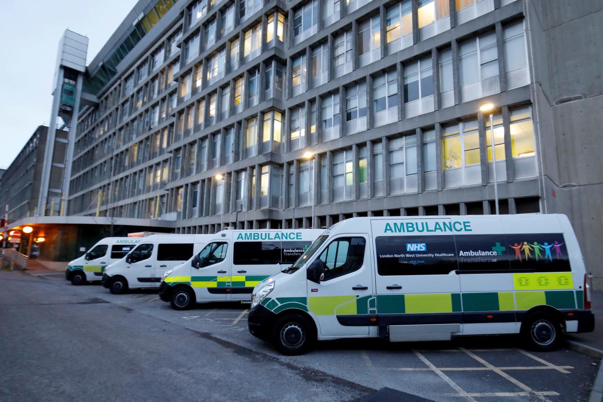 Ambulances are pictured outside Northwick Park Hospital in London on March 20, 2020, where they have declared a "critical incident" due to a surge in patients with covid-19. - Britain's government Friday rolled out a series of extra measures including direct grants to cover wages of employees who have been temporarily furloughed, as it ordered cafes, pubs and restaurants to close entirely. (Photo by Tolga AKMEN / AFP) (Photo by TOLGA AKMEN/AFP via Getty Images)