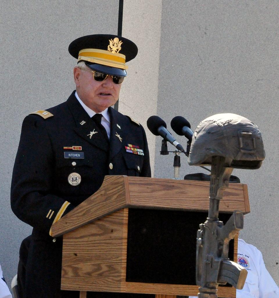 Retired Capt. Ken Kitchen tells veterans in the crowd that gathered Monday for Wooster's Memorial Day service to keep sharing their stories so people can remember what the holiday is about.