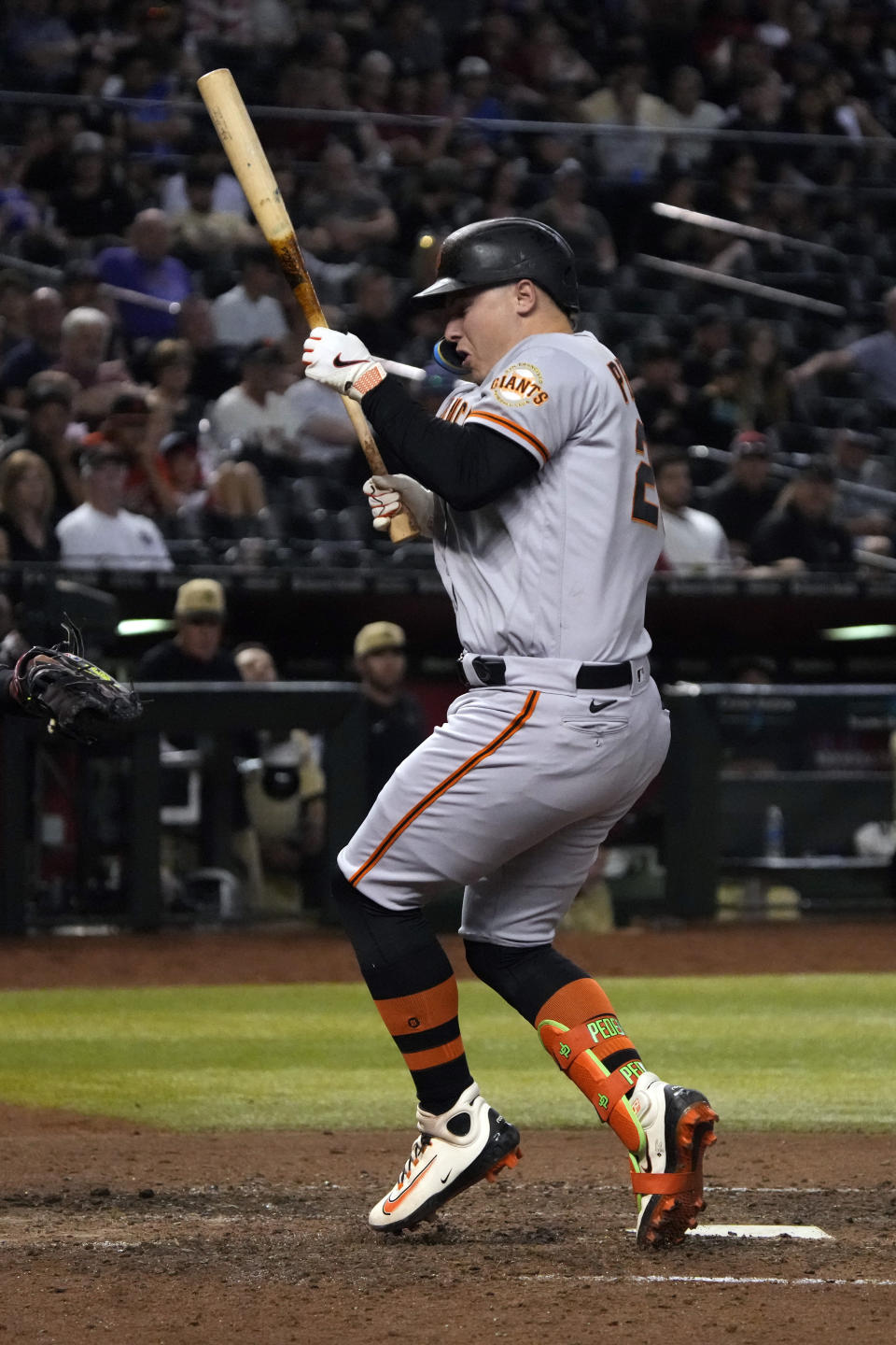 San Francisco Giants' Joc Pederson is hit by a pitch from Arizona Diamondbacks' Scott McGough during the eighth inning of a baseball game Friday, May 12, 2023, in Phoenix. (AP Photo/Rick Scuteri)