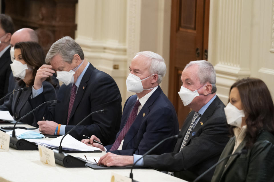 Gov. Kathy Hochul, D-N.Y., left, Gov. Roy Cooper, R-N.C., Gov. Asa Hutchinson, R-Ark., Gov. Phil Murphy, D-N.J., Gov. Gretchen Whitmer , D-Mich., listen as President Joe Biden speaks during a meeting with the National Governors Association in the East Room of the White House, Monday, Jan. 31, 2022, in Washington. (AP Photo/Alex Brandon)