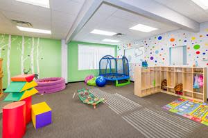 Large indoor playroom with many opportunities for play-based learning.