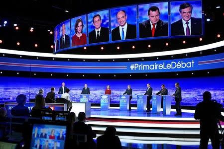From L-R, French politicians Bruno Le Maire, Alain Juppe, Nathalie Kosciusko-Morizet, Nicolas Sarkozy, Jean-Francois Cope, Jean-Frederic Poisson and Francois Fillon attend the first prime-time televised debate for the French conservative presidential primary in La Plaine Saint-Denis, near Paris, France, October 13, 2016. REUTERS/Martin Bureau/Pool