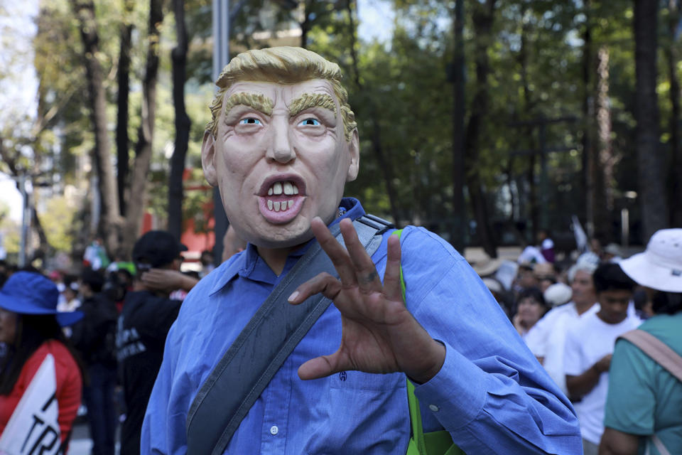 <p>A man wears a mask depicting U.S. President Donald Trump during a march demanding respect for Mexico and its migrants, in the face of perceived hostility from the Trump administration, in Mexico City, Feb 12, 2017. (Photo: Christian Palma/AP) </p>