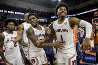 Auburn guard Wendell Green Jr. (1) and guard K.D. Johnson (0) celebrates after defeating Kentucky during the second half of an NCAA college basketball game Saturday, Jan. 22, 2022, in Auburn, Ala. (AP Photo/Butch Dill)