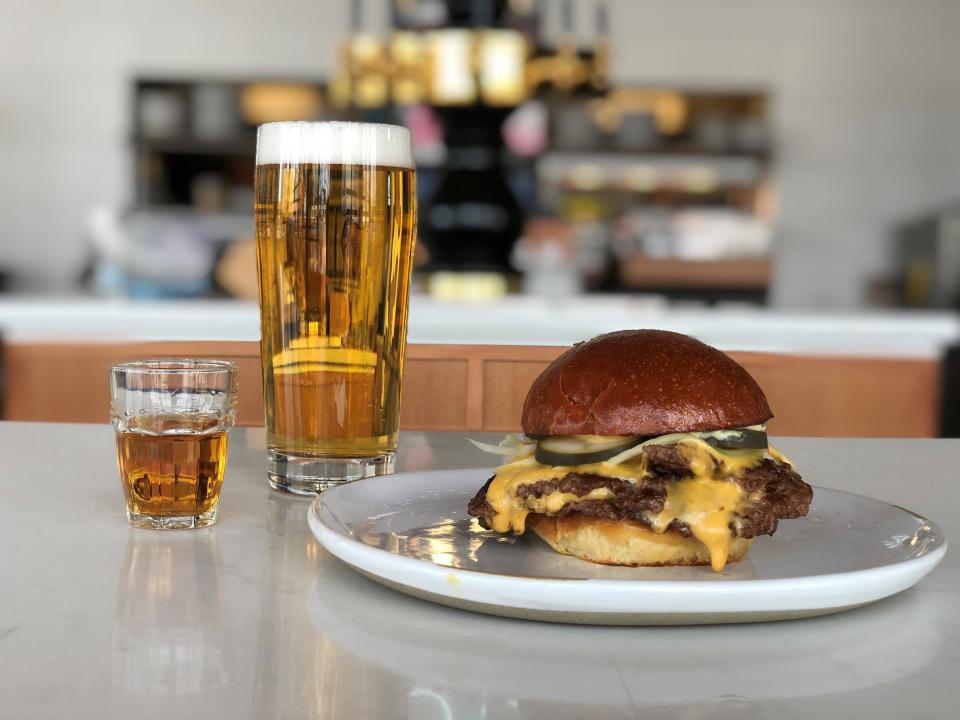 The CFD burger at Clyde's Fine Diner has two patties with American cheese, onions, pickles and burger sauce.