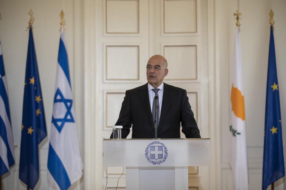 Greek Foreign Minister Nikos Dendias speaks during a join news conference with Israel's counterpart Gabi Ashkenazi and Cypriot Foreign Minister Nikos Christodoulides after a meeting between the foreign Ministers of Greece , Israel and Cyprus in Athens, on Tuesday, Oct. 27, 2020. (AP Photo/Petros Giannakouris)