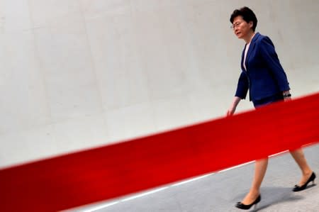 Hong Kong Chief Executive Carrie Lam walks to speaking to media over an extradition bill in Hong Kong