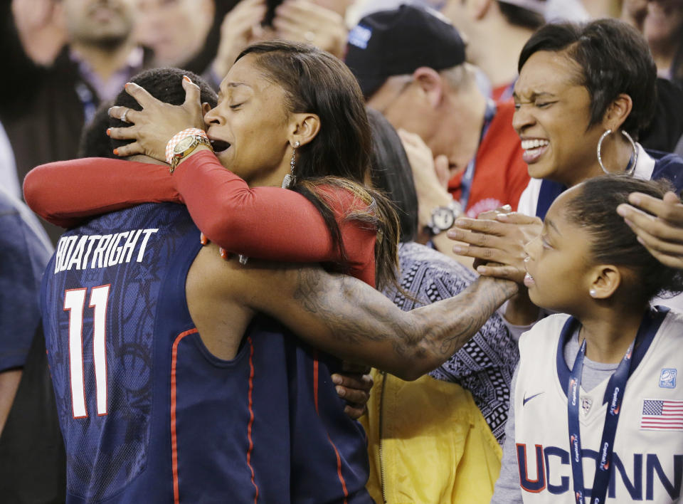 Connecticut guard Ryan Boatright (11) gets a hug after his team beat Florida 63-53 at their NCAA Final Four tournament college basketball semifinal game Saturday, April 5, 2014, in Arlington, Texas. (AP Photo/Eric Gay)