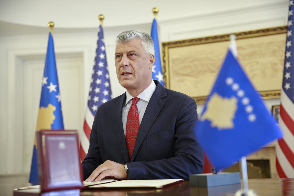 Kosovo's President Hashim Thaci signs the Order of Freedom awarded to U.S President Donald Trump, in capital Pristina, Kosovo on Friday, Sept. 18, 2020. Kosovo's president awarded U.S. President Donald Trump with one of the country's highest medals - Kosovo's Order of Freedom - for his government's efforts on peace and reconciliation in the former war-torn region. (AP Photo/Visar Kryeziu)