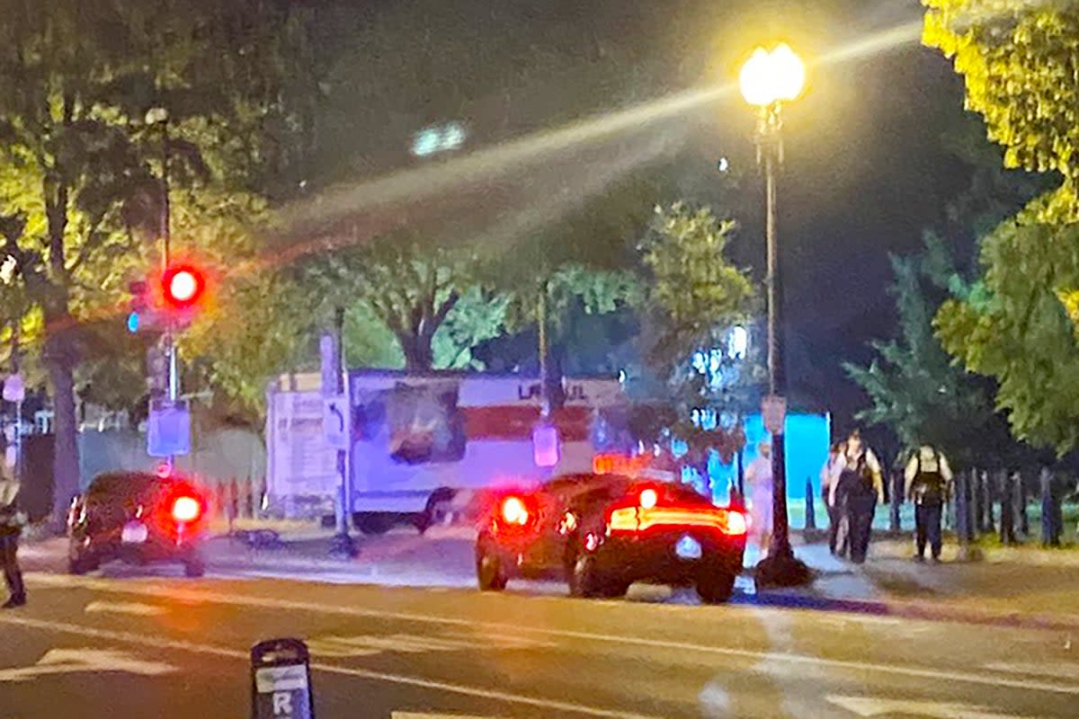 A box truck is seen crashed into a security barrier near the White House (Reuters)