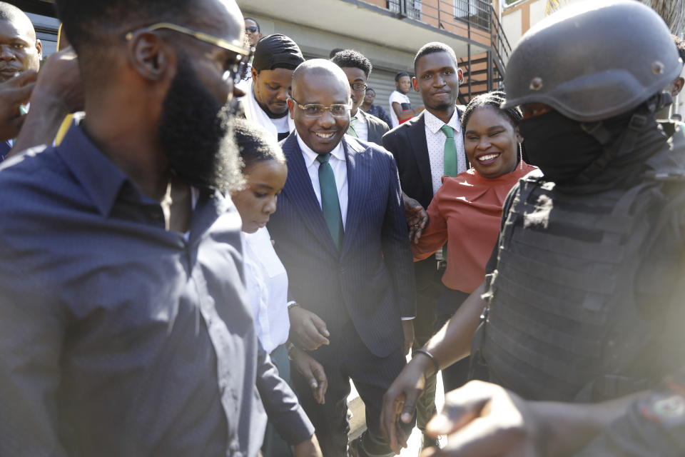 Haiti's former interim Prime Minister Claude Joseph leaves court after appearing for questioning before the investigating judge in a corruption case in Port-au-Prince, Haiti, Monday, Jan. 8, 2024. A judge in Haiti has issued arrest warrants for more than 30 high-ranking officials related to the alleged misappropriation of funds or equipment connected to Haiti’s National Equipment Center. (AP Photo/Odelyn Joseph)