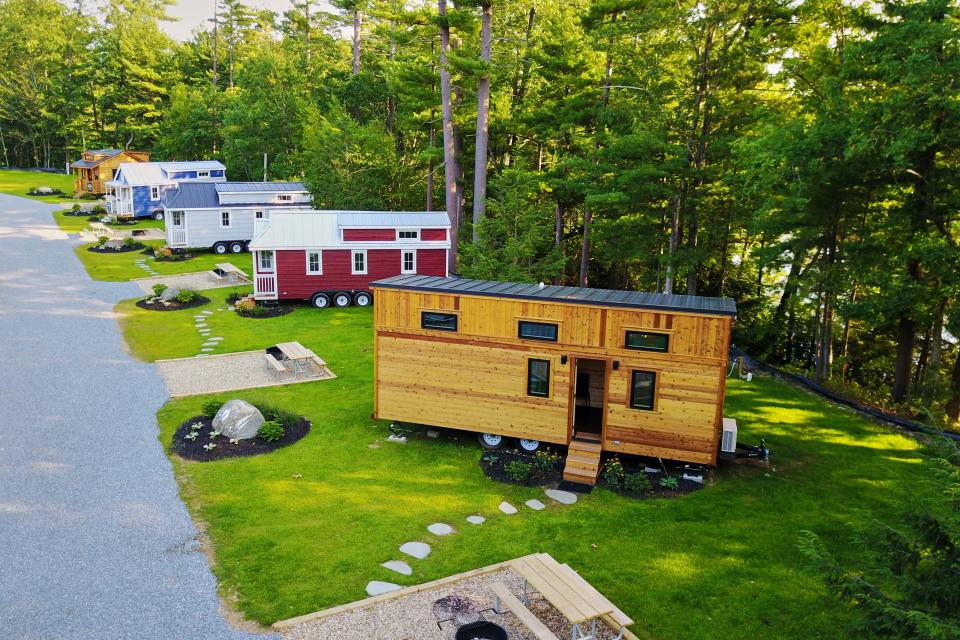 Tuxbury Pond's largest tiny home, Emerson (right), can sleep up to six people.