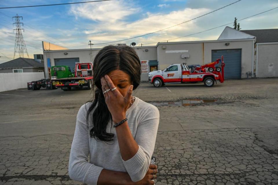 Nicole Casper, who recently had her motor home towed during a homeless sweep by the city, tries not to cry while attempting to get sentimental possessions back Monday at Chima’s Tow yard in Sacramento. “It just leaves you devastated. It’s beyond words,” she said.