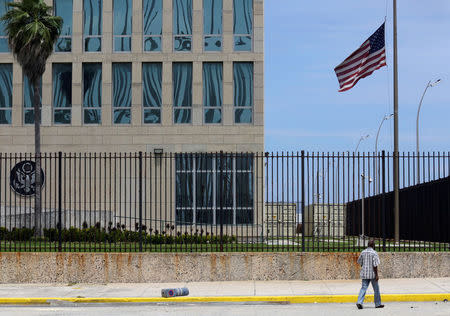 A man walks near the U.S. embassy in Havana, Cuba, July 20, 2016. REUTERS/Enrique de la Osa
