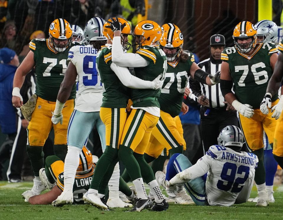 Green Bay Packers kicker Mason Crosby is embraced by punter Pat O'Donnell after kicking the winning field goal during overtime against the Dallas Cowboys on Nov. 13, 2022.