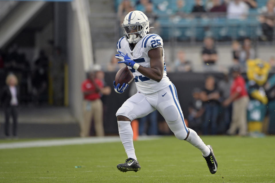 Indianapolis Colts running back Marlon Mack gains yardage against the Jacksonville Jaguars during the first half of an NFL football game, Sunday, Dec. 29, 2019, in Jacksonville, Fla. (AP Photo/Phelan M. Ebenhack)
