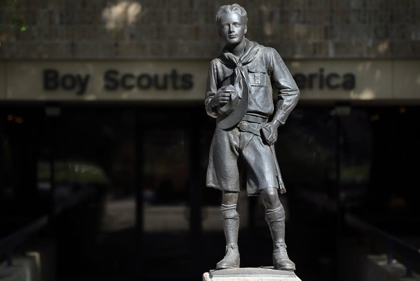 The Boy Scouts of America executive committee has put forth a resolution to lift the ban on gay members, to be voted on by the Scouts' National Council in May. Above, a statue of a Scout stands outside the BSA offices in Irving, Texas.