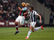 <p>West Ham United’s Sofiane Feghouli (left) and West Bromwich Albion’s Gareth McAuley battle for possession</p>