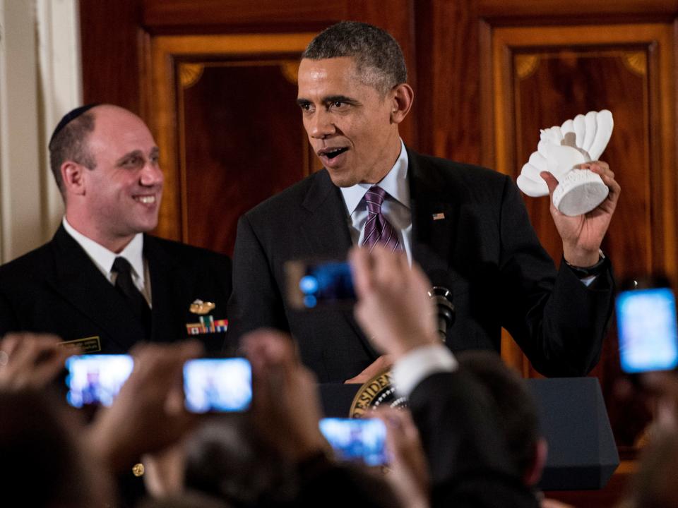 President Barack Obama holds a "menurkey," a combination of a menorah and turkey.