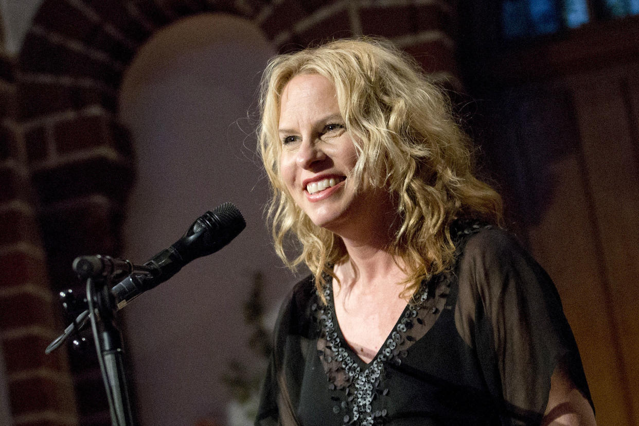 Vonda Shepard at a microphone during a performance.