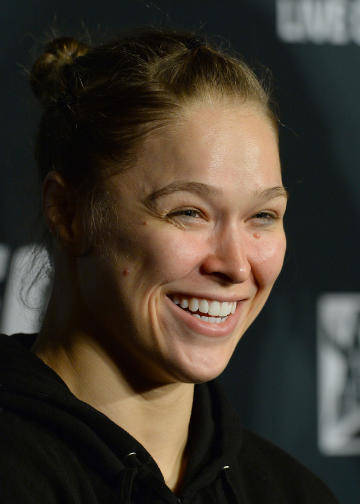 Ronda Rousey laughs at a question during the UFC 184 post-fight press conference. (USAT)