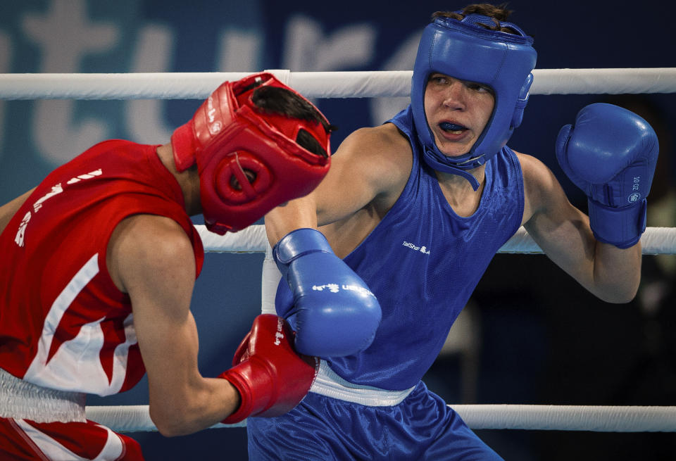 In this photo provided by the International Olympic Committee, Maksym Halinichev of Ukraine, right, competes against Abdumalik Khalokov of Uzbekistan in the Boxing Men's Bantam (56kg) Gold Medal Bout at the Oceania Pavilion of Youth Olympic Park during the Youth Olympic Games in Buenos Aires, Argentina, Thursday, Oct. 18, 2018. As one of Ukraine’s most promising boxing prospects, Halinichev could have been shielded from the war. (Jonathan Nackstrand/IOC via AP)