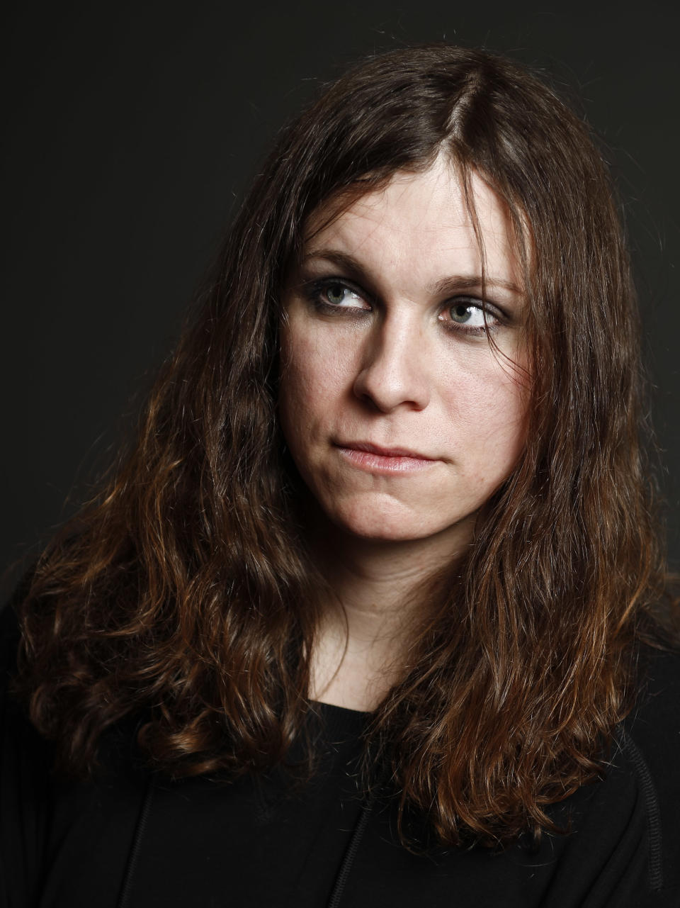 This Jan. 10, 2014 photo shows Laura Jane Grace, formerly known as Tom Gabel, of the band Against Me!, in New York. Grace, 33, publicly came out as transgender in 2012. She was born Tom Gabel and performed with the Florida-based band since 1997. The group’s latest album, “Transgender Dysphoria Blues,” a concept record about a transgender prostitute, marked a chart high for the band when it reached No. 23 on the Billboard 200 albums chart in late January. (Photo by Brian Ach/Invision/AP)