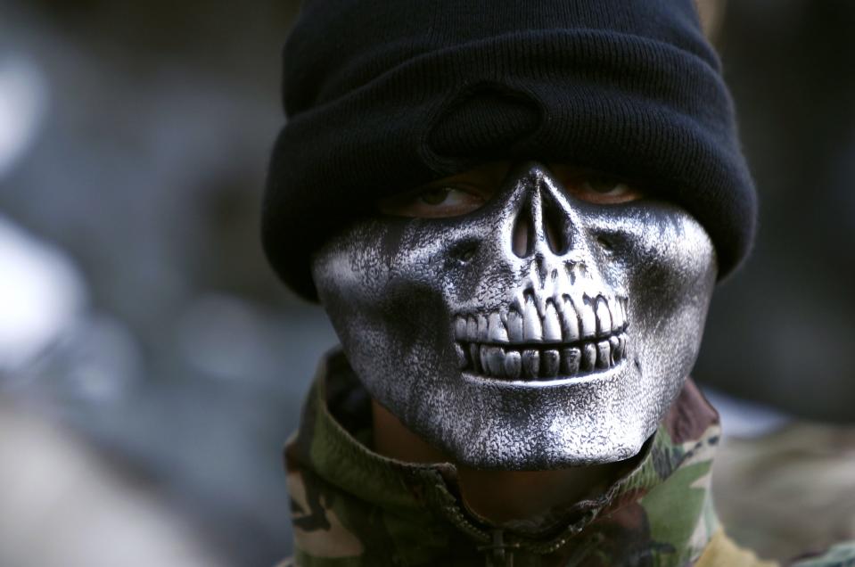 An anti-government protester attends a rally in Kiev