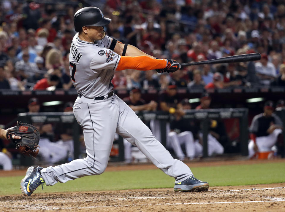 Marlins' slugger Giancarlo Stanton launches his 57th homer of the season. (AP)