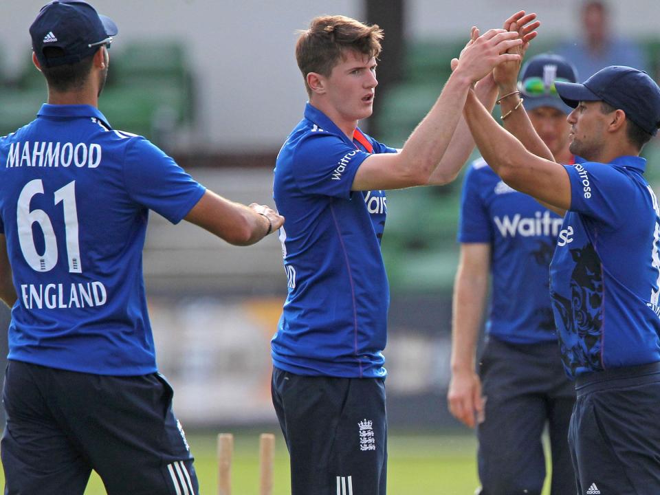 George Garton is congratulated by Brett D'Oliveira after taking the wicket of Thisara Perera: Getty