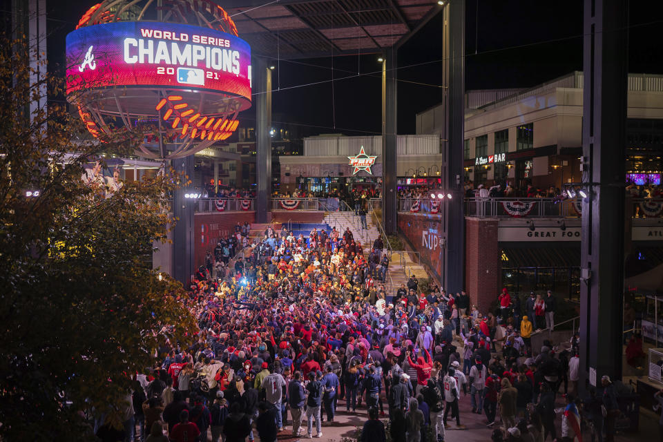 Atlanta Braves fans celebrate near Truist Park, Tuesday, Nov. 2, 2021, in Atlanta. The Atlanta Braves have won their first World Series championship since 1995, hammering the Houston Astros 7-0 in Game 6. (AP Photo/Rita Harper)