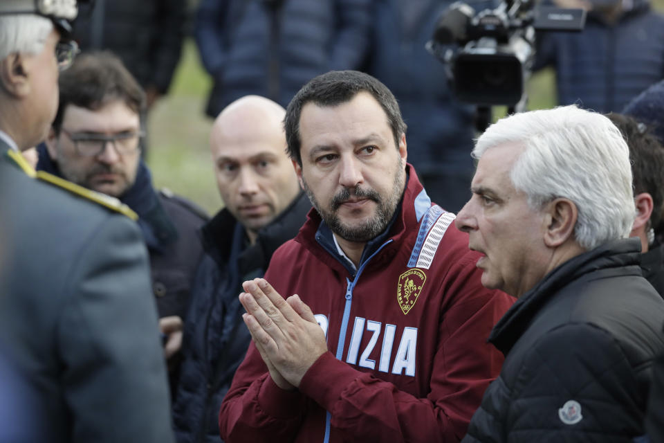 Italian Interior Minister and Deputy-Premier Matteo Salvini, flanked by Ancona's head of Police Oreste Capocasa leaves disco Lanterna Azzurra after a site inspection, in Corinaldo, central Italy, Saturday, Dec. 8, 2018. A stampede at a rap concert in an overcrowded disco in central Italy killed five young teenagers and a woman who had accompanied her daughter to the event early Saturday, police said, adding that 59 people were injured. (AP Photo/Andrew Medichini)