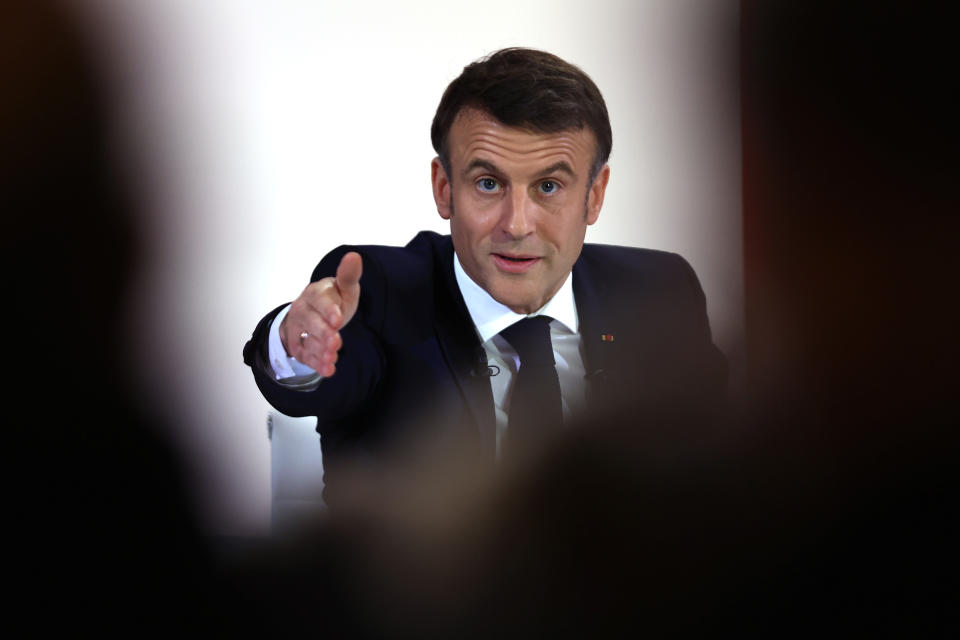 French President Emmanuel Macron gestures during his first prime-time news conference to announce his top priorities for the year as he seeks to revitalize his presidency, vowing to focus on "results" despite not having a majority in parliament, Tuesday, Jan. 16, 2024 at the Elysee Palace in Paris. (AP Photo/Aurelien Morissard)