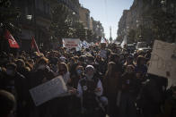 Students march during a demonstration in Marseille, southern France, Tuesday Jan. 26, 2021. Teachers and university students marched together in protests or went on strike Tuesday around France to demand more government support amid the pandemic. Sign in front reads in French "education for all".(AP Photo/Daniel Cole)