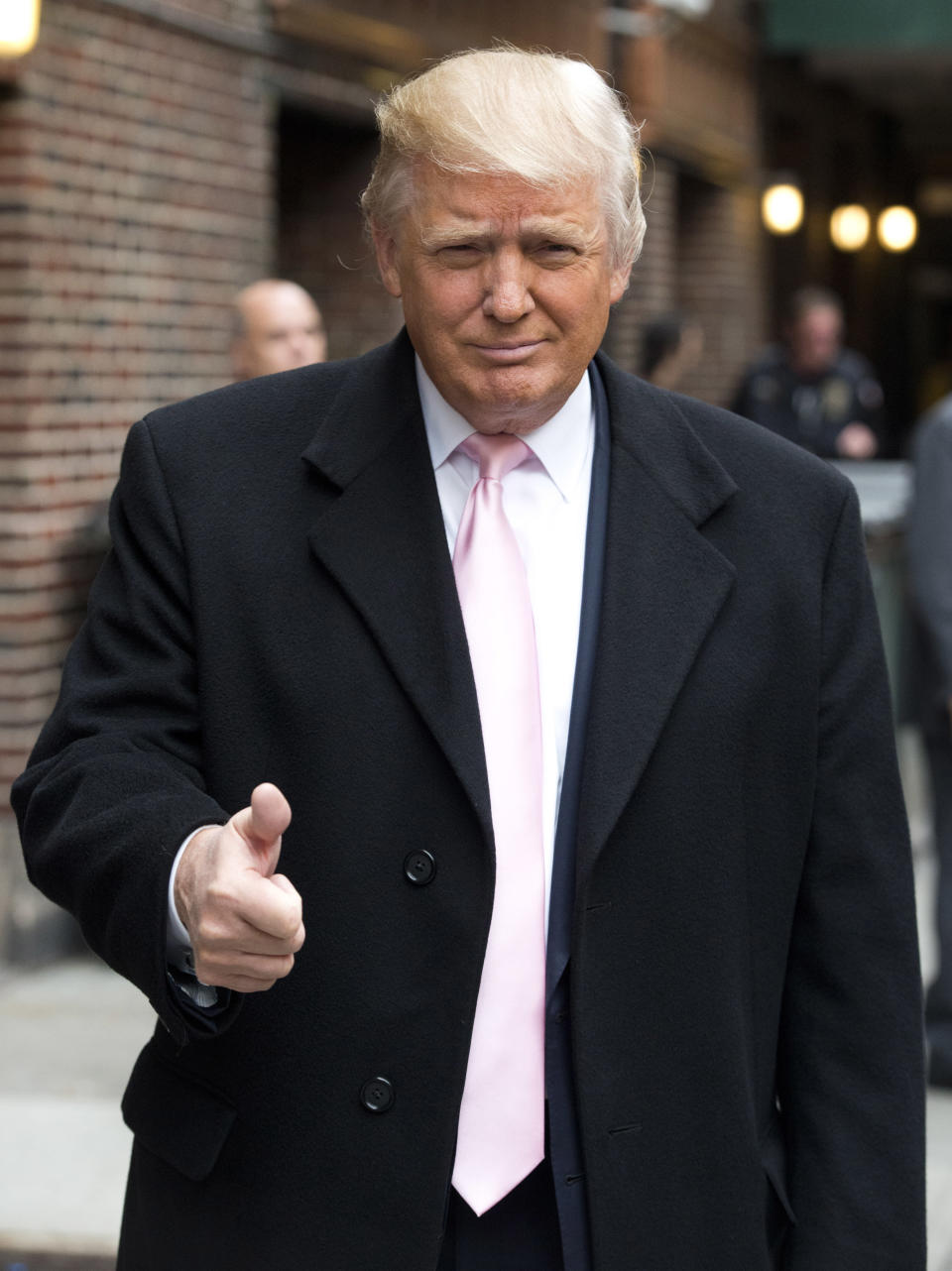 Donald Trump leaves an appearance on the "Late Show with David Letterman" on Thursday, Oct. 25, 2012 in New York.   (Photo by Charles Sykes/Invision/AP) 