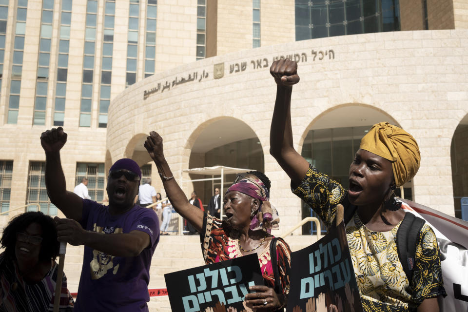 Members of the African Hebrew Israelites of Jerusalem rally outside of the District Court in Beersheba, Israel, ahead of a hearing on the deportation orders for dozens from their community, Wednesday, July 19, 2023. Over the decades, the community has made inroads into Israeli society, and most of them have citizenship or residency rights. But 130 members remain undocumented, and Israeli authorities have ordered them to leave. The orders have left dozens of people, some of whom have lived most of their lives in Israel, in an uncertain legal limbo.(AP Photo/Maya Alleruzzo)