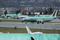 A Boeing 737 Max airplane being built for Norwegian Air International taxis for a test flight, Wednesday, Dec. 11, 2019, at Renton Municipal Airport in Renton, Wash. The chairman of the House Transportation Committee said Wednesday that an FAA analysis of the 737 Max performed after a fatal crash in 2018 predicted "as many as 15 future fatal crashes within the life of the fleet" during opening remarks at the committee's fifth hearing on the Boeing 737 Max. (AP Photo/Ted S. Warren)