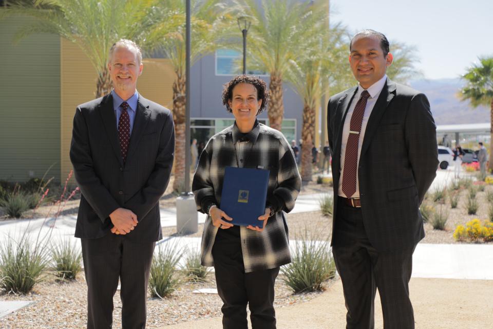 Ioana Robles (middle) was named 2022 Riverside County Site Support Employee of the Year by Riverside County Office of Education Superintendent Edwin Gomez (right). They pose with Palm Springs Unified Superintedent Mike Swize (left) in Palm Springs, Calif., on Friday, March 11, 2022.