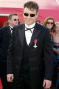 <p>Russell Crowe — who went home with the Oscar for Best Actor for his performance in <em>Gladiator —</em> arrived at the 2001 Oscars wearing some creative accessories.</p>