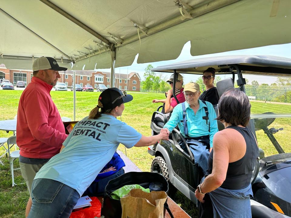 Arvin Brown (on golf cart) donated land near Crown College that has become the Angora Frog Farm.