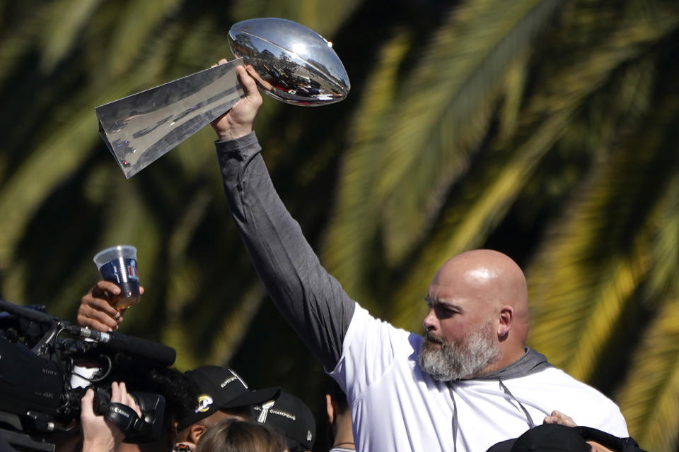 Los Angeles Rams offensive lineman Andrew Whitworth holds up the Vince Lombardi Super Bowl trophy during the team's victory parade in Los Angeles, Wednesday, Feb. 16, 2022, following their win Sunday over the Cincinnati Bengals in the NFL Super Bowl 56 football game. (AP Photo/Marcio Jose Sanchez)