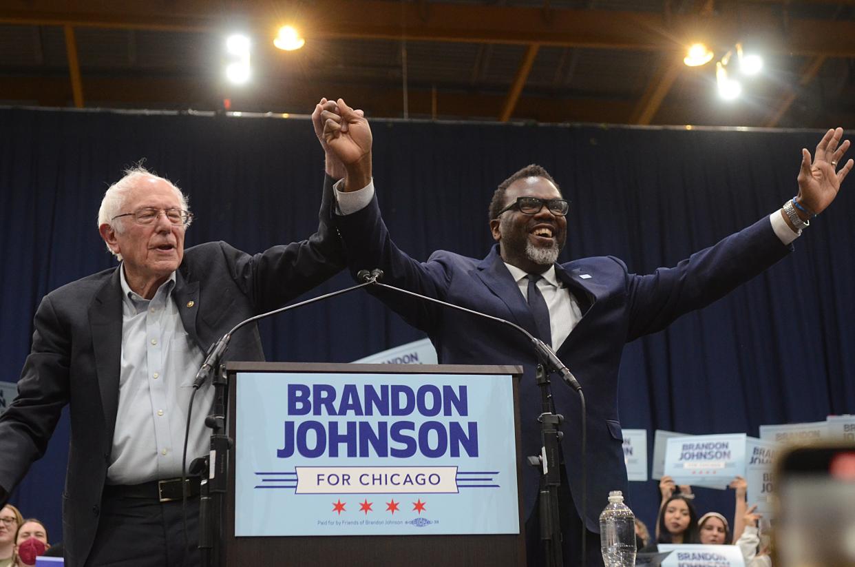 Sen. Bernie Sanders and progressive mayoral candidate Brandon Johnson, right