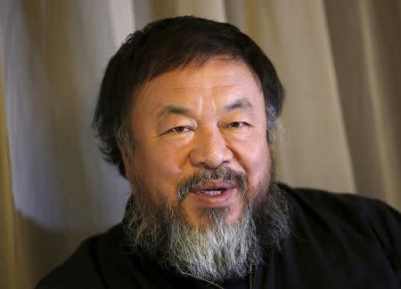 Dissident Chinese artist Ai Weiwei speaks during an interview with Reuters at his hotel in Beijing March 24, 2015. REUTERS/Kim Kyung-Hoon