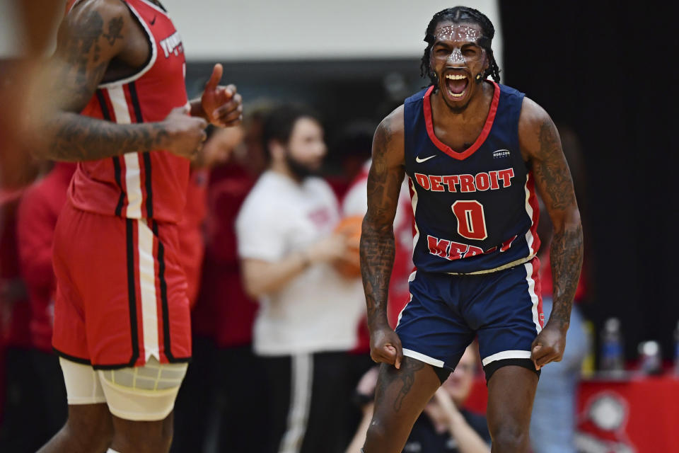 Detroit Mercy guard Antoine Davis (0) reacts after a 3-point basket against Youngstown State during the first half of an NCAA college basketball game in the quarterfinals of the Horizon League tournament Thursday, March 2, 2023, in Youngstown, Ohio.(AP Photo/David Dermer)