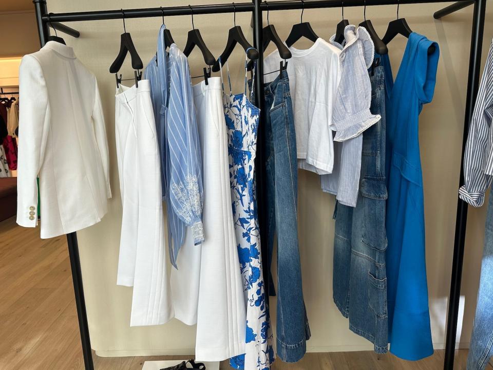 A rack of blue and white clothing.